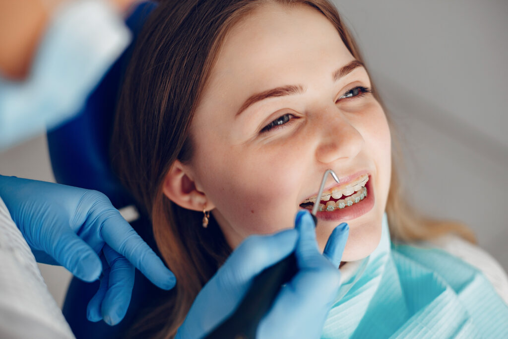 Orthodontist near me making adjustment to braces at LakeStone Orthodontics